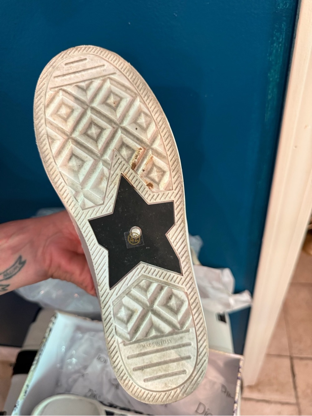 White Sneaker with Black Star Sole Detail